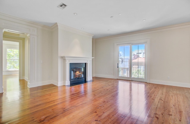 1 Vendue Range Range Unit I, Charleston, SC 29401 - unfurnished living room with plenty of natural light, light wood finished floors, crown molding, a fireplace with flush hearth, and baseboards