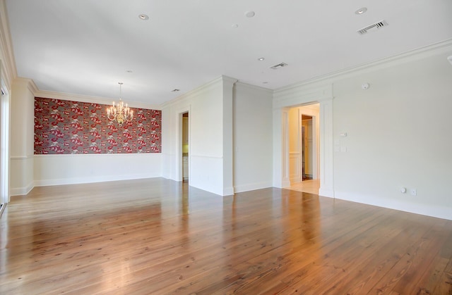 1 Vendue Range Range Unit I, Charleston, SC 29401 - empty room featuring wallpapered walls, ornamental molding, a chandelier, light wood finished floors, and wainscoting