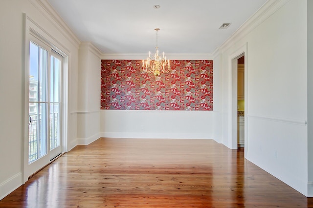 1 Vendue Range Range Unit I, Charleston, SC 29401 - unfurnished dining area with wallpapered walls, a chandelier, a wainscoted wall, wood finished floors, and crown molding