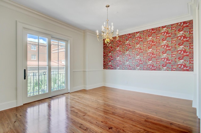 1 Vendue Range Range Unit I, Charleston, SC 29401 - unfurnished room featuring a chandelier, ornamental molding, wallpapered walls, wood finished floors, and baseboards