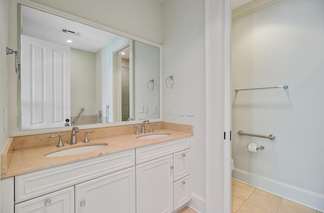 1 Vendue Range Range Unit I, Charleston, SC 29401 - bathroom featuring toilet, double vanity, tile patterned flooring, and baseboards