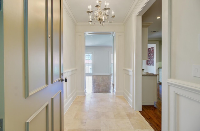 1 Vendue Range Range Unit I, Charleston, SC 29401 - hallway featuring a decorative wall, ornamental molding, and a chandelier