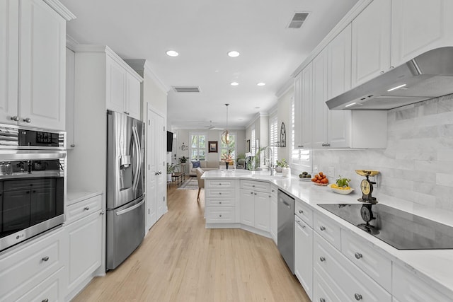 kitchen featuring visible vents, white cabinets, under cabinet range hood, and stainless steel appliances