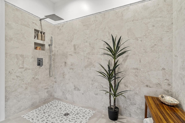 full bathroom with a tile shower