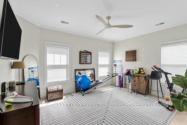 misc room with visible vents, ceiling fan, and plenty of natural light