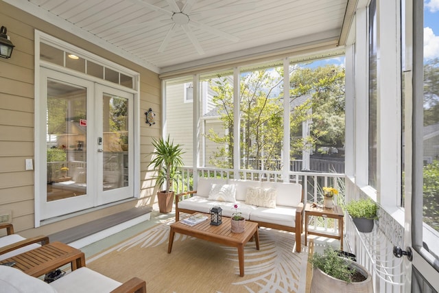 sunroom / solarium featuring a wealth of natural light, french doors, ceiling fan, and an outdoor hangout area