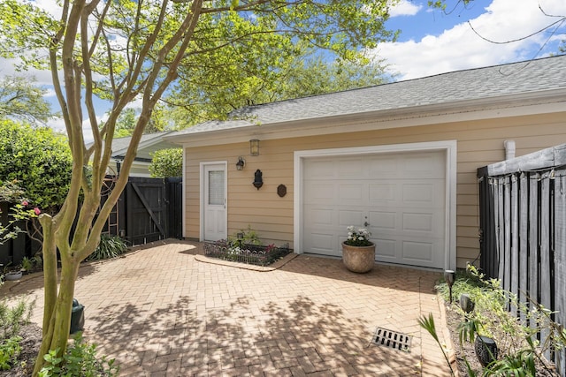 garage with fence