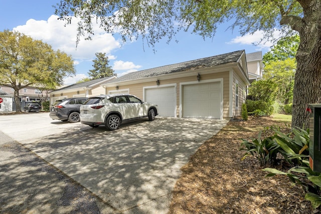 garage with concrete driveway