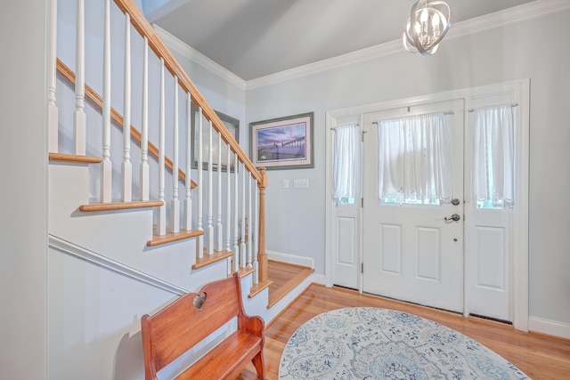 entrance foyer featuring light hardwood / wood-style flooring and ornamental molding