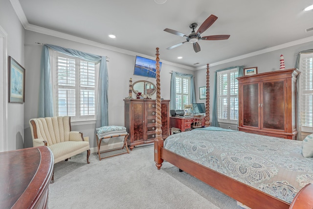 carpeted bedroom with ceiling fan and crown molding