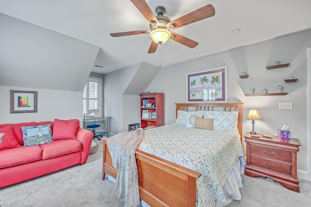 carpeted bedroom featuring vaulted ceiling and ceiling fan