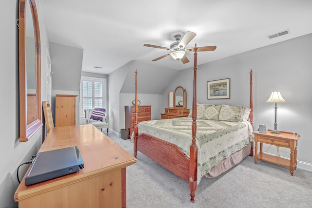 bedroom featuring ceiling fan, lofted ceiling, and light carpet