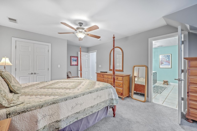 bedroom featuring a closet, ceiling fan, and light colored carpet