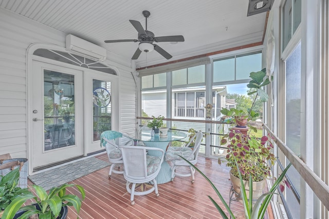 sunroom / solarium with ceiling fan, a wealth of natural light, and a wall mounted AC