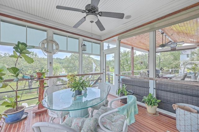 sunroom / solarium with ceiling fan