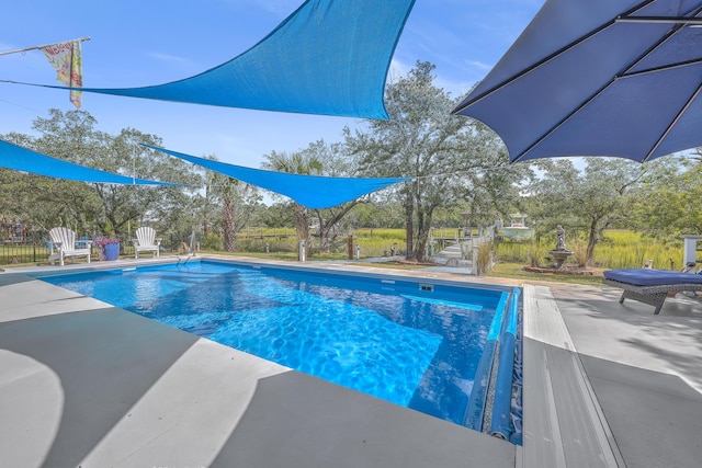 view of pool featuring a patio