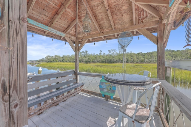 wooden terrace with a gazebo and a water view