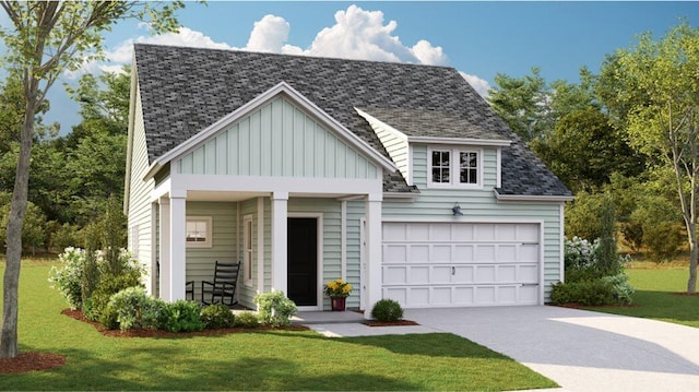 view of front of house featuring a front lawn and a garage