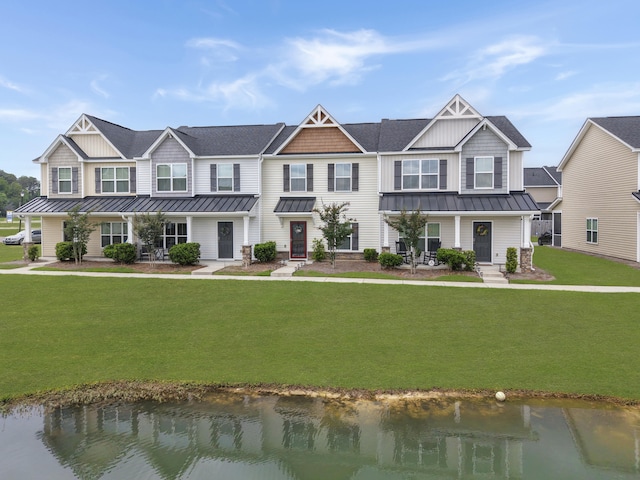 view of front of property with a standing seam roof, a porch, and a water view