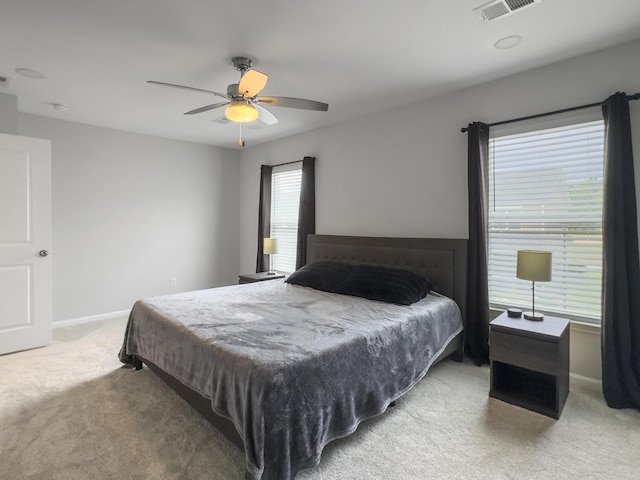 bedroom with carpet floors, baseboards, and a ceiling fan