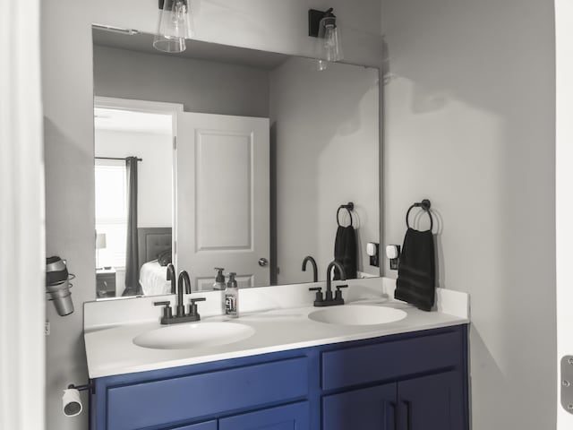 ensuite bathroom featuring double vanity