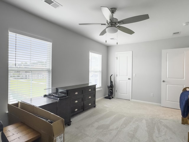 sitting room featuring ceiling fan, light carpet, and baseboards