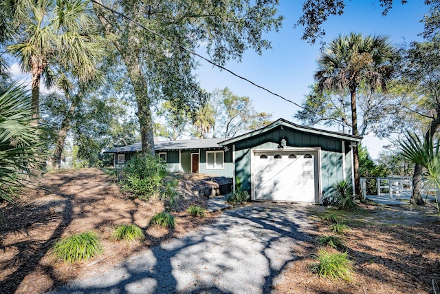 single story home featuring a garage