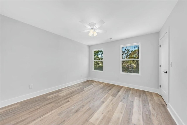 unfurnished room with light wood-type flooring and ceiling fan