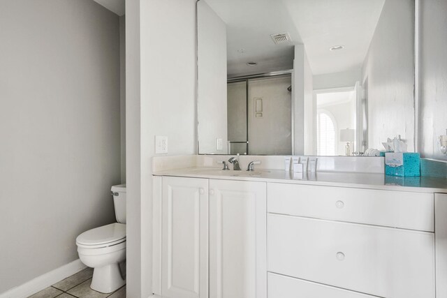 9002 Palmetto Dr Unit 420, Isle Of Palms, SC 29451 - full bath with toilet, vanity, baseboards, tile patterned flooring, and a shower with door