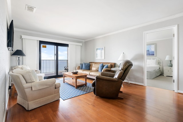 9002 Palmetto Dr Unit 420, Isle Of Palms, SC 29451 - living area with wood finished floors, ornamental molding, and baseboards