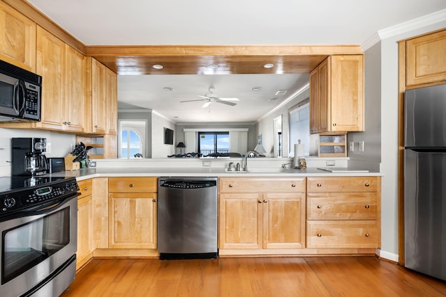 9002 Palmetto Dr Unit 420, Isle Of Palms, SC 29451 - kitchen featuring stainless steel appliances, a ceiling fan, light wood finished floors, crown molding, and a sink