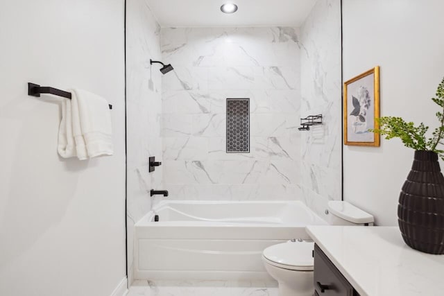 full bathroom featuring vanity, toilet, and tiled shower / bath