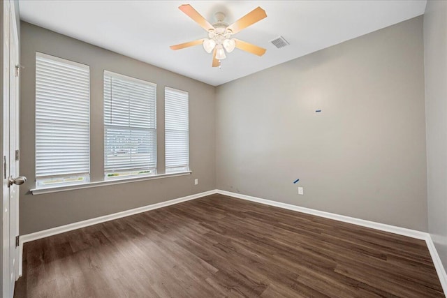 unfurnished room featuring dark hardwood / wood-style floors and ceiling fan