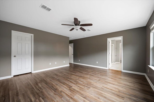 unfurnished room with hardwood / wood-style floors and ceiling fan