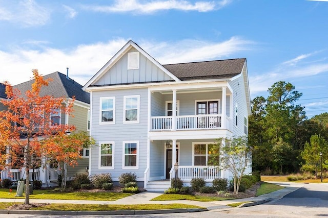 view of front of house with a porch and a balcony