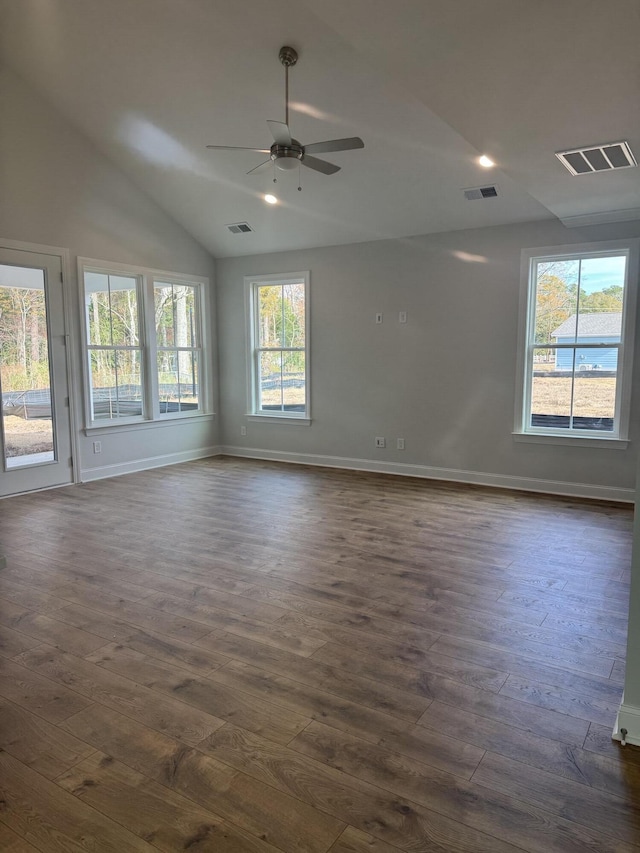 empty room with ceiling fan, lofted ceiling, and dark wood-type flooring