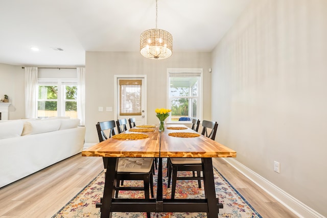 3010 Grinnell St, Johns Island, SC 29455 - dining space with light wood-style flooring, a chandelier, baseboards, and recessed lighting