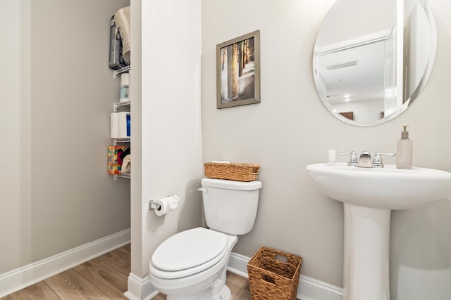 3010 Grinnell St, Johns Island, SC 29455 - half bathroom featuring wood finished floors, toilet, and baseboards