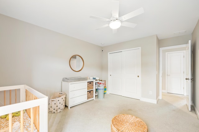 3010 Grinnell St, Johns Island, SC 29455 - bedroom with carpet floors, a nursery area, a closet, baseboards, and a ceiling fan