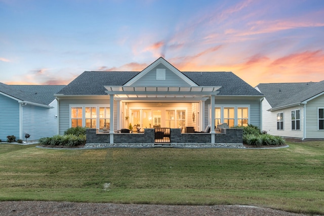 view of front of house with a lawn and a pergola