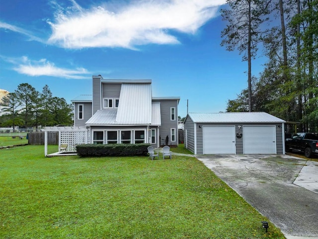 49 Auld Brass Rd, Walterboro, SC 29488 - view of front facade with a chimney, an outbuilding, metal roof, a front lawn, and driveway
