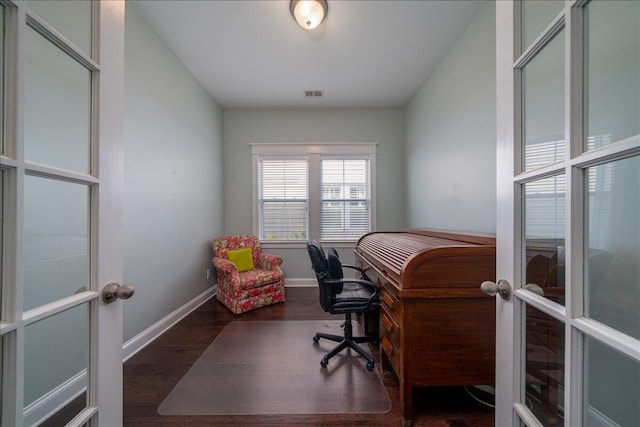 home office with visible vents, baseboards, wood finished floors, and french doors