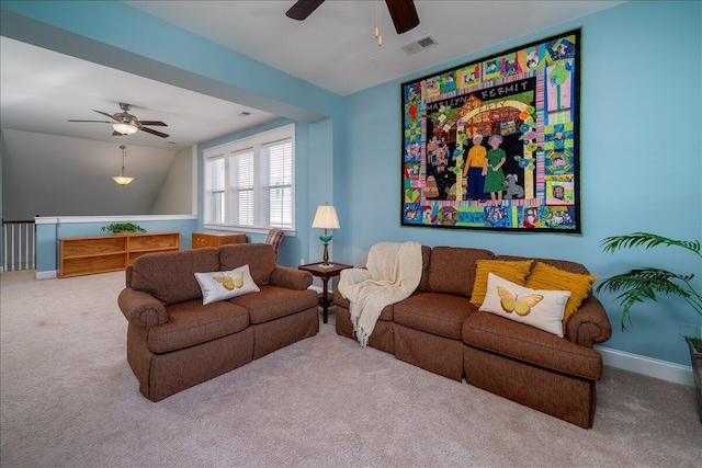 carpeted living room featuring visible vents, baseboards, ceiling fan, and vaulted ceiling