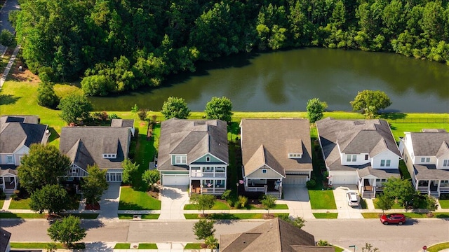 birds eye view of property with a residential view and a water view