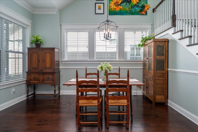 dining room featuring baseboards, an inviting chandelier, wood finished floors, and ornamental molding