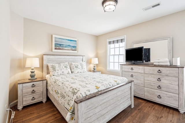 bedroom with dark wood-type flooring