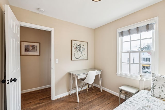 bedroom with dark hardwood / wood-style flooring