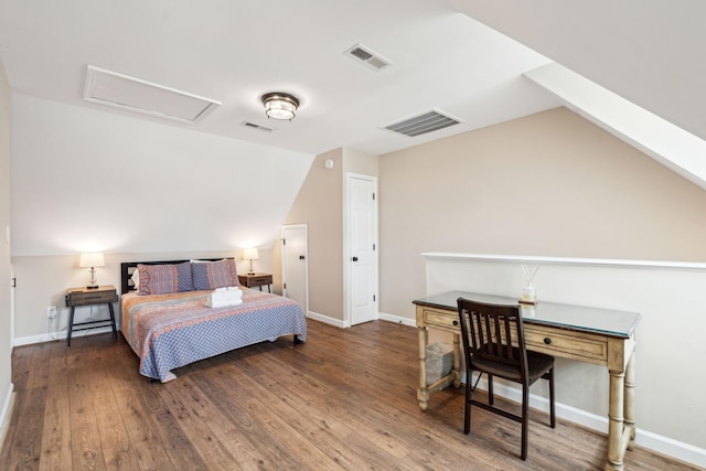 bedroom with lofted ceiling and dark wood-type flooring