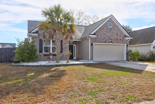 view of front of home featuring brick siding, an attached garage, fence, driveway, and a front lawn