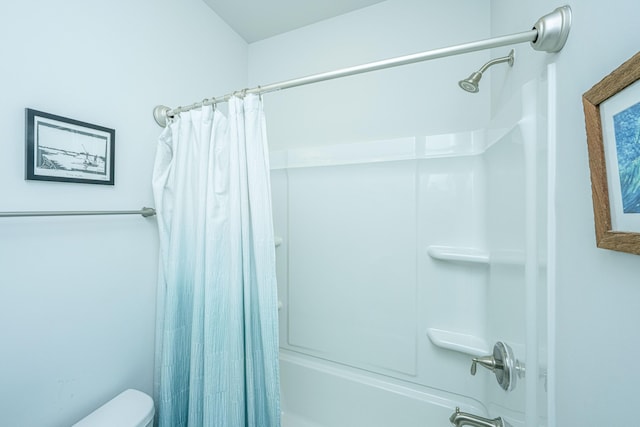 bathroom featuring toilet and shower / bath combo with shower curtain